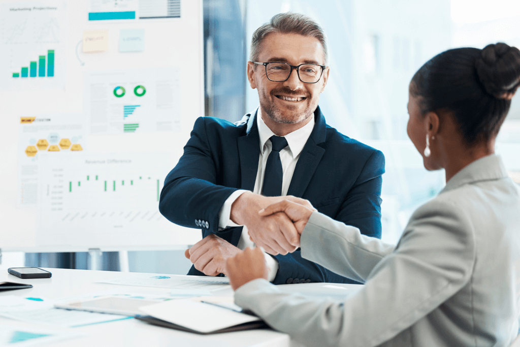 business people at a meeting, shaking hands