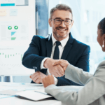 business people at a meeting, shaking hands